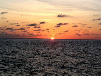 Sunset off the coast of Costa Rica aboard the Okeanos Agg... by Charlie Foreman 
